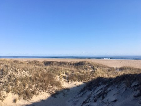 Calm and beautiful ocean and big dunes at the north end.